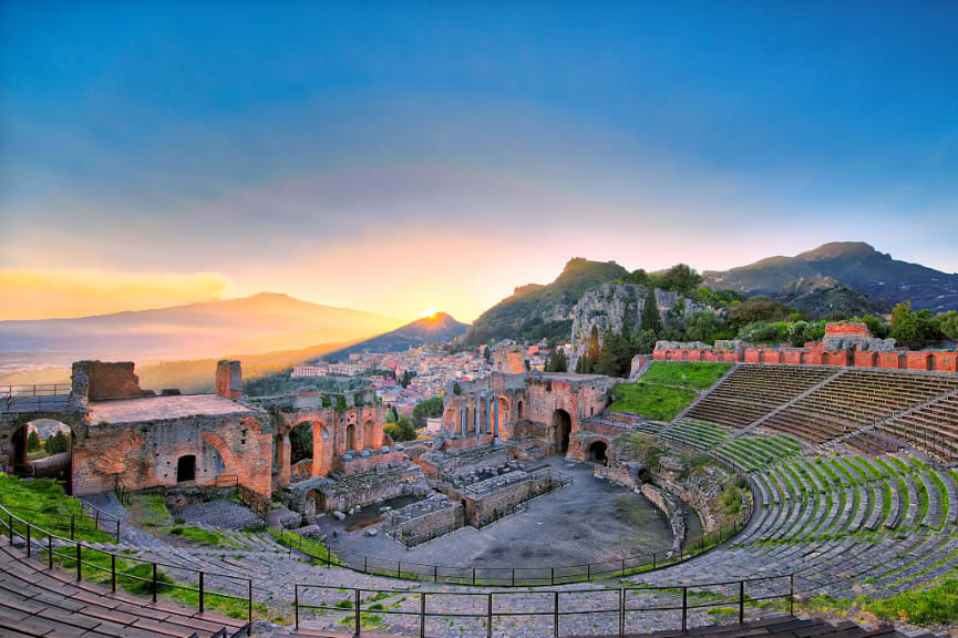 View of the ancient greek theater of Taormina with Etna in Italian region of Sicily.