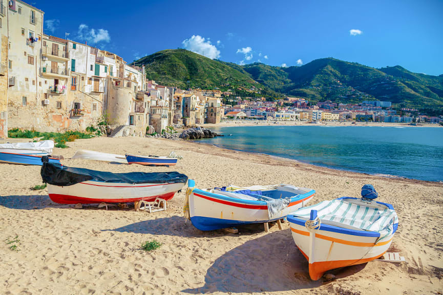 Colorful wooden fishing boats on the beach in old wooden fishing boats on the beach of Cefalu