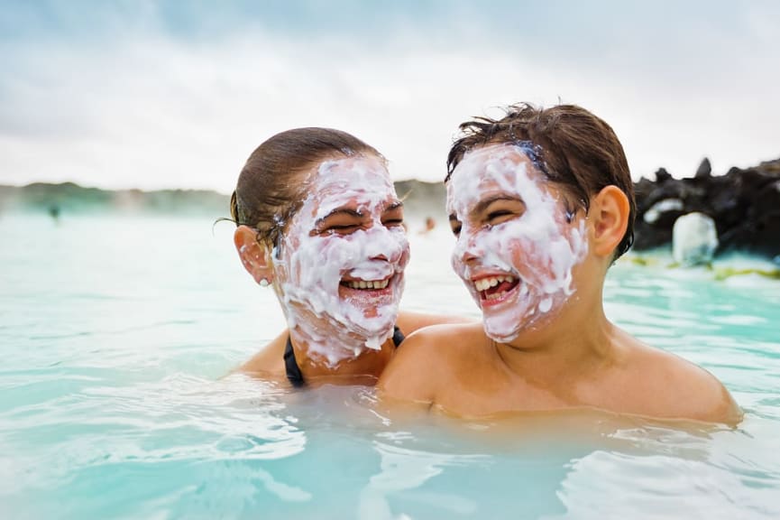 Mother and son having fun together at the Blue Lagoon in Iceland