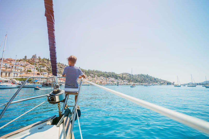 Young boy sailing in Greece