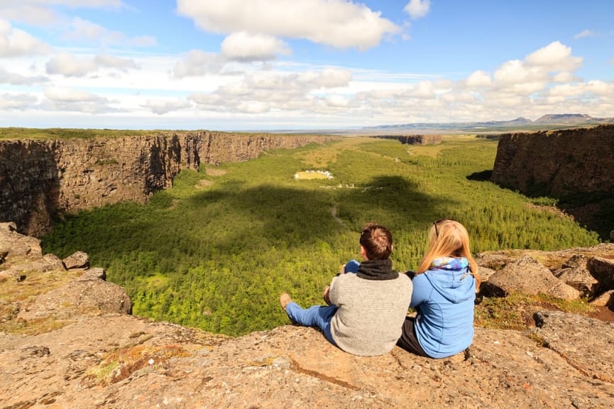 Couple enjoying the view at Asbyrgi canyon in Jokulsargljufur National Park