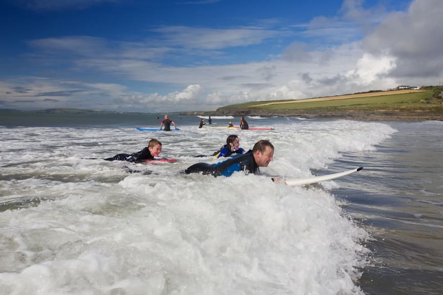 Family surfing at Garretstown Beach in Ireland.  Photo courtesy of Brian Morrison / Tourism Ireland