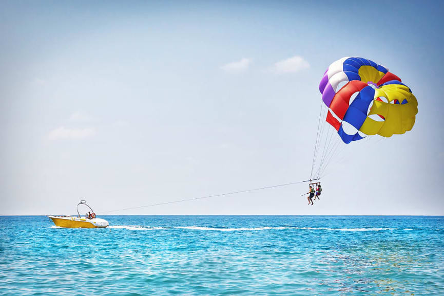 Family parasailing at a beach in Alanya, Turkey