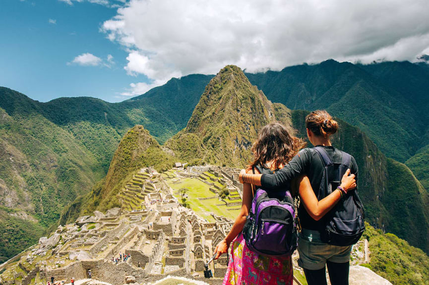 Couple visiting Machu Picchu, Peru