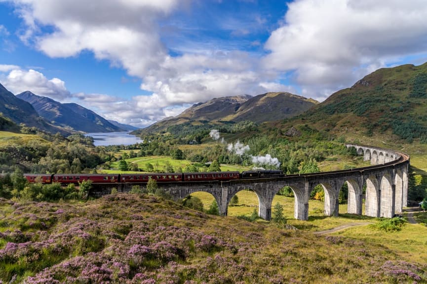 Glenfinnan railway viaduct with Jacobite Steam Train in Scotland