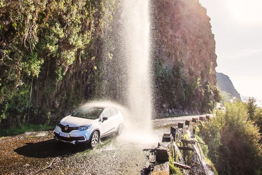 Driving under waterfall in Madeira, Portugal