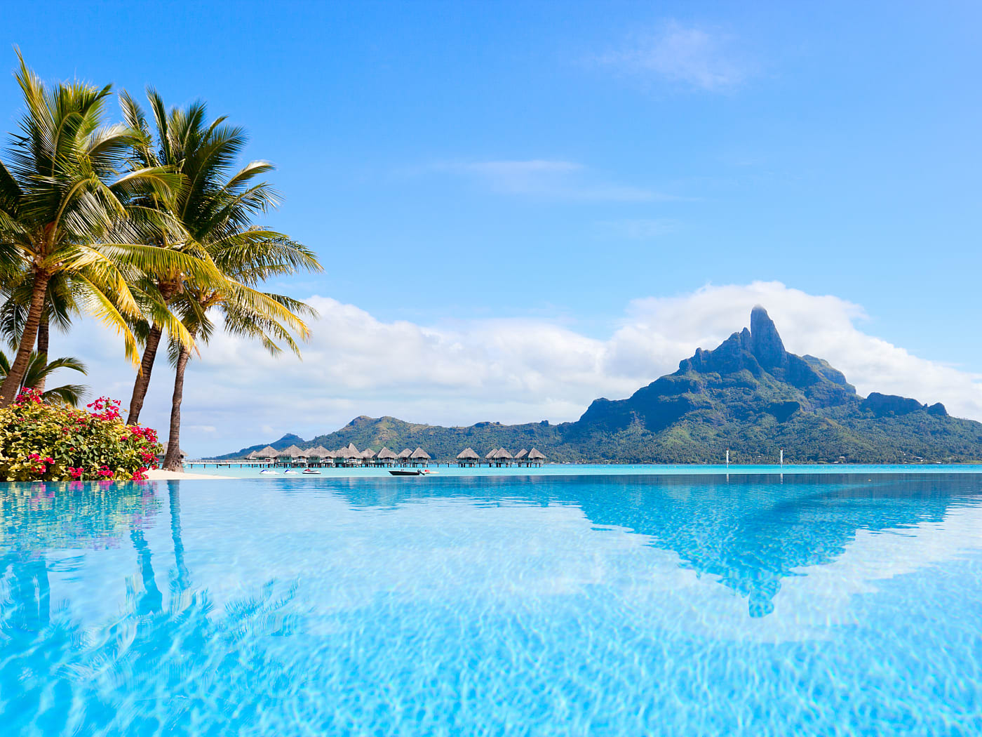 Resort pool with bungalows and Mount Otemanu in Bora Bora, French Polynesia