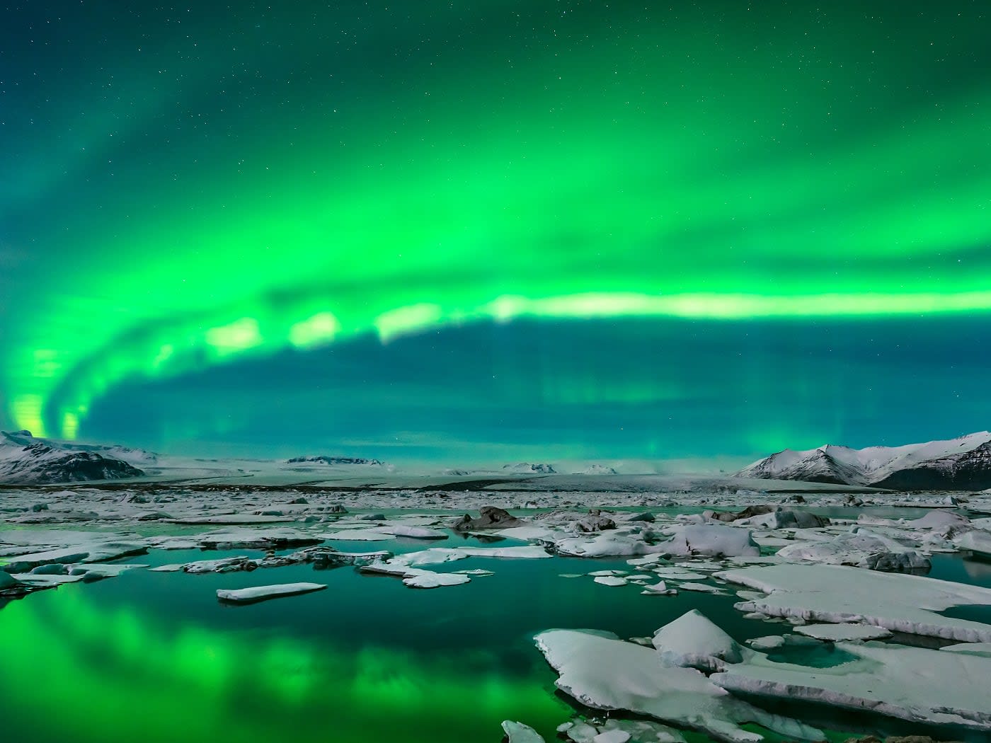 View of northern lights over Jokulsarlon in Iceland.