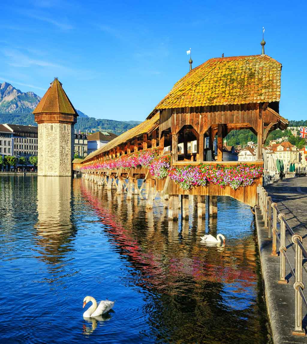 Deck covered in flowers on a lake in Switzerland.