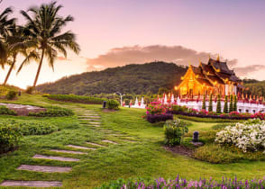 Pathway through gardens leading to Kor Khum Luang Temple at Royal Park Rajapruek in Chiang Mai, Thailand