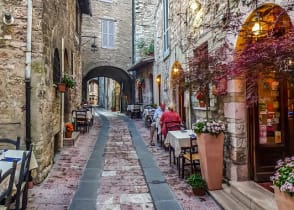 Senior couple at outdoor cafe in Assisi, Umbria, Italy