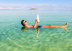 Tourist floating on the Dead Sea in Israel