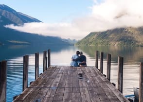 Couple sitting on the pier at Nelson Lake National Park