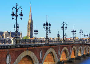 Bordeaux river bridge with St. Michel Cathedral in France