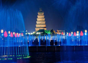 Illuminated water show at 1300-year-old Wild Goose Pagoda in Xian, China.