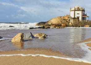 Capela do Senhor da Pedra, a small church on the shore, Porto, Portugal