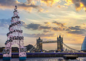 Winter sunrise in London with the Tower Bridge and festive Christmas tree