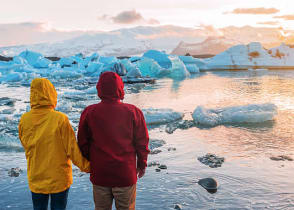 couple at Jokulsarlon Glacier Lagoon in Iceland