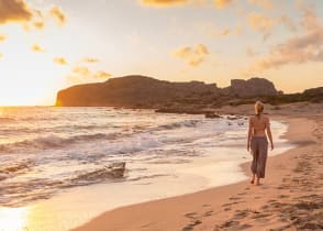 Romantic Greece Getaway: Athens, Santorini & Crete - Walking along Falasnara Beach at sunset in Western Crete