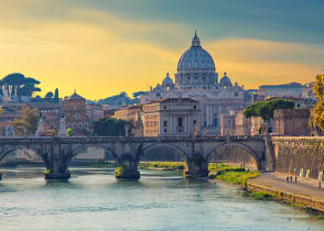 Boat sailing on Tiber River with Saint Peter's Basilica in Rome, Italy