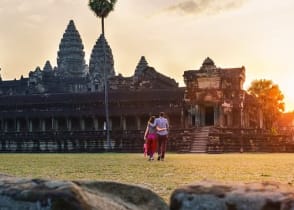 Couple walking thru Angkor Wat in Siem Reap, Cambodia