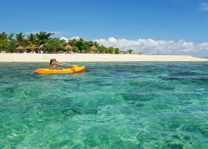 Woman kayaking in the Mamanuca Islands, Fiji