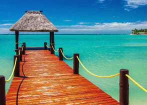 Wooden jetty on tropical beach in Fiji