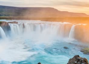 Waterfall of the gods at sunset in Iceland