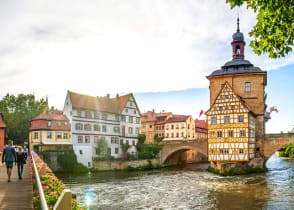 Couple walking across a bridge in Bamberg, Germany.