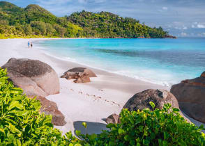 Couple on beautiful Anse Intendance beach on Mahe island, Seychelles