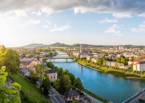 Evening panoramic view over Stadt Salzburg with Salzach river in Austria.