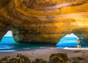 Family exploring the Benagil Caves in Algarve, Portugal