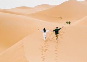 Couple at the Sahara desert in Morocco