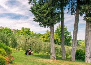 Couple relaxing and enjoying the view of the Tuscany countryside in Italy