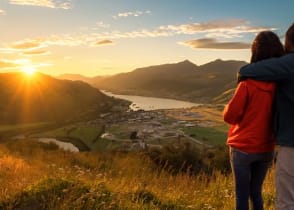 Couple enjoying a sunset in New Zealand 