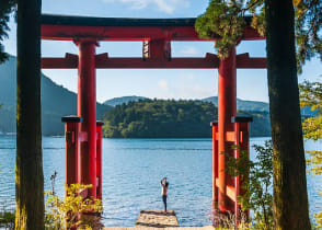 A Torii gate by lake in Hakone, Japan.