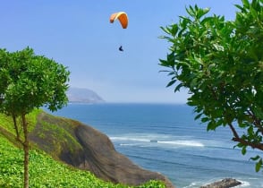 People paragliding in Miraflores, Lima, Peru.