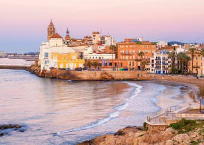 Sand beach and historical Old Town in mediterranean resort Sitges, Spain