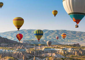 Hot air balloon floating above Cappadocia, Turkey.