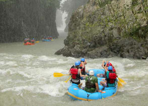 Rafting down the mountain river along the stunning waterfalls