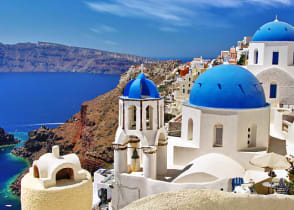 Santorini blue domes with caldera and ocean