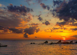 Canoeing Lake Malawi at sunset