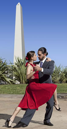 Tango dancers perform passionately near Obelisk in Buenos Aires.