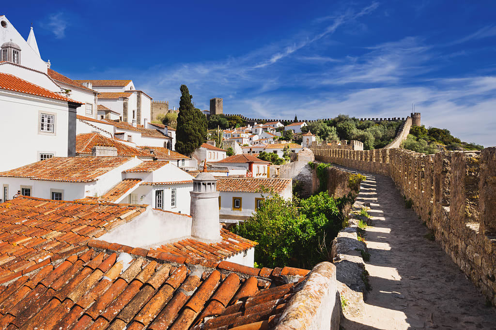 Walking the castle walls around the medieval town of Óbidos, Portugal