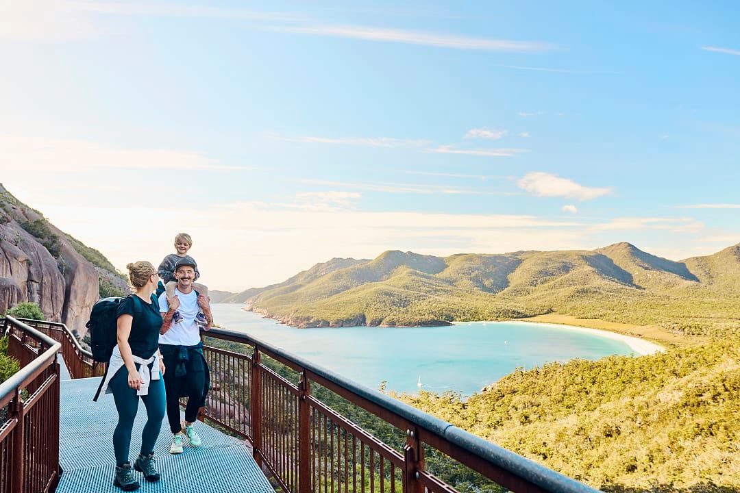 A family enjoying the beautiful natural landscapes of Freycinet National Park.
