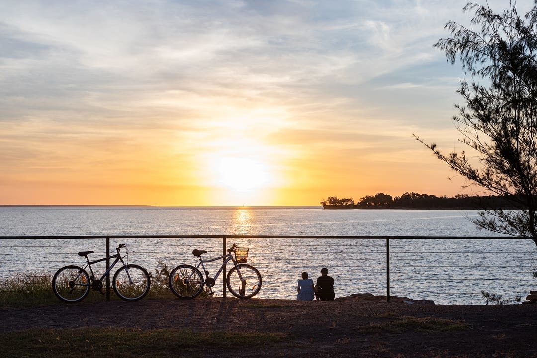 Couple watching the sunset in Darwin, Australia.