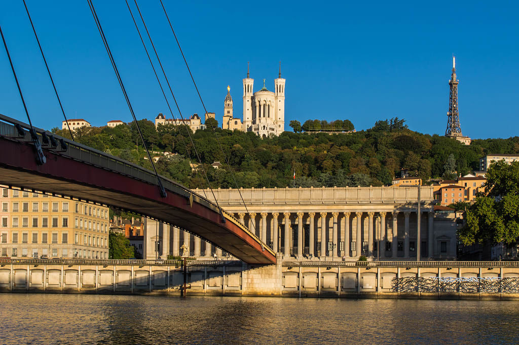 Bridge over the Saône river with Notre-Dame de Fourviere Basilica on the hill in Lyon, France