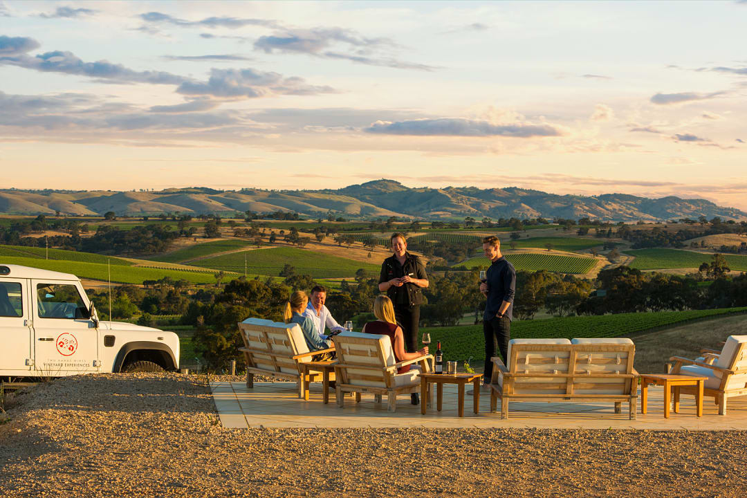 A group of people enjoying a wine tasting experience in Barossa Valley, photo courtesy of South Australia Tourism.