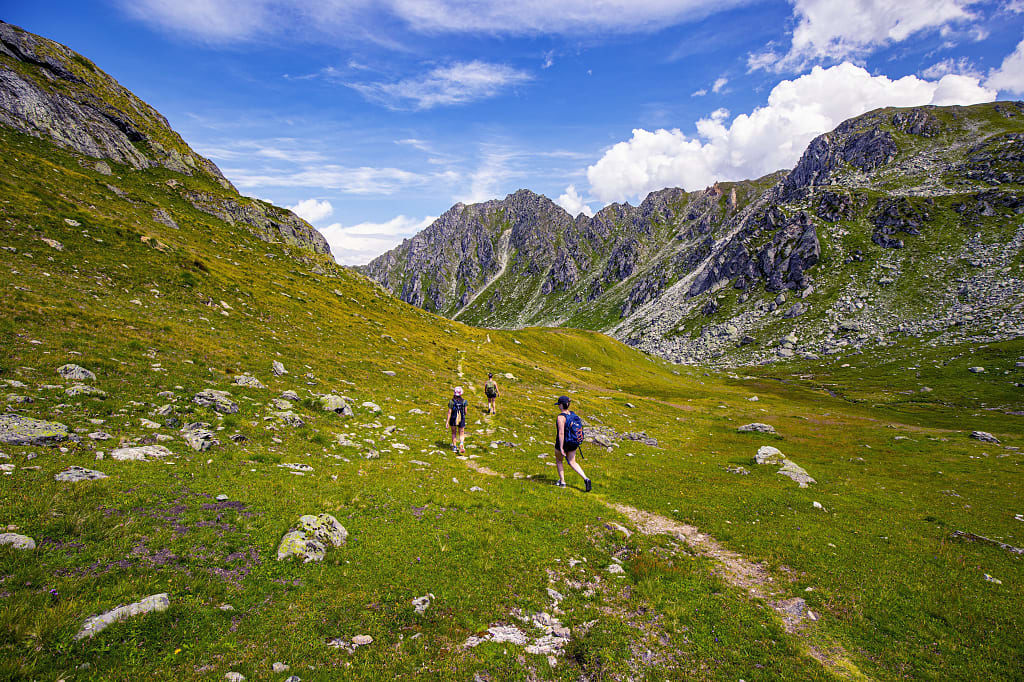 Three young women hiking in Nendaz, Switzerland