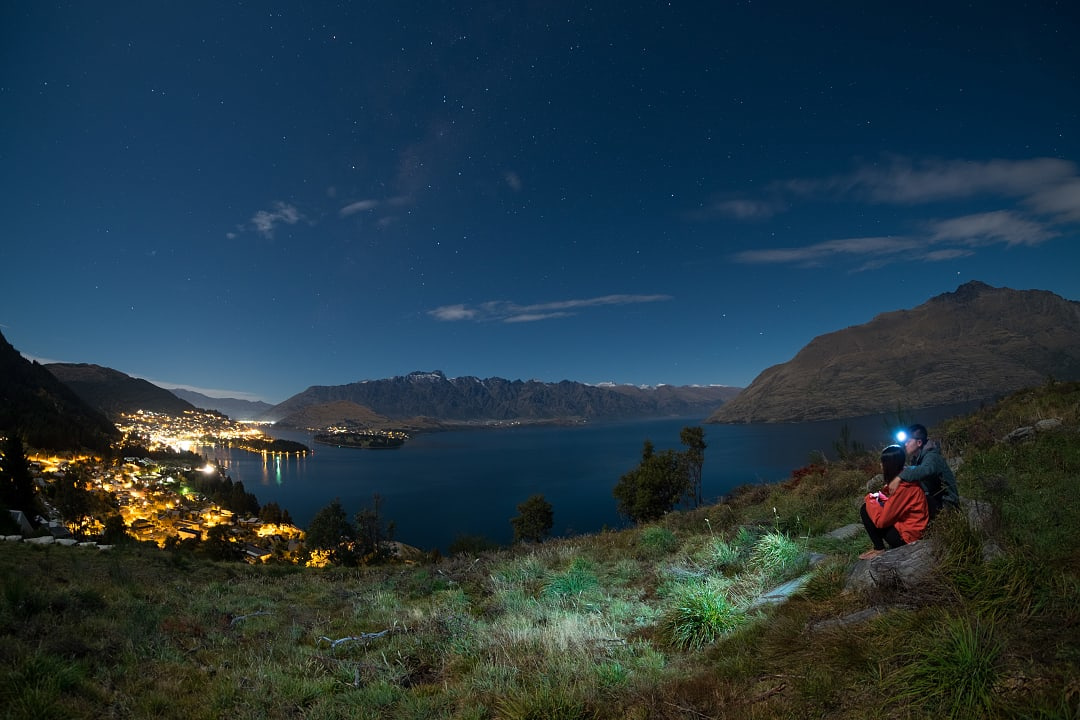 Couple in Queenstown observing the stars